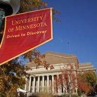 "Driven to Discover" flag outside of Northrop Auditorium